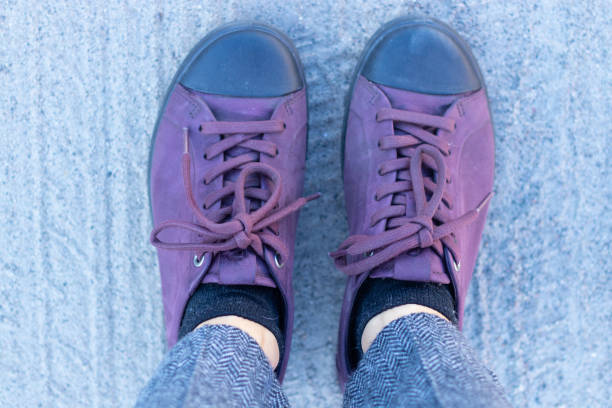 istock female legs stand on the ground top view 1510574528