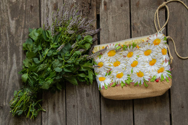 istock small handmade bag and blooming mint on an old wooden table 1510576618