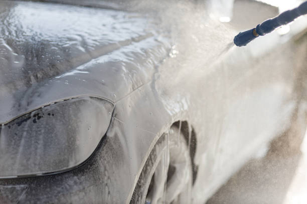 istock Worker washing car at self-service car wash 1510607177
