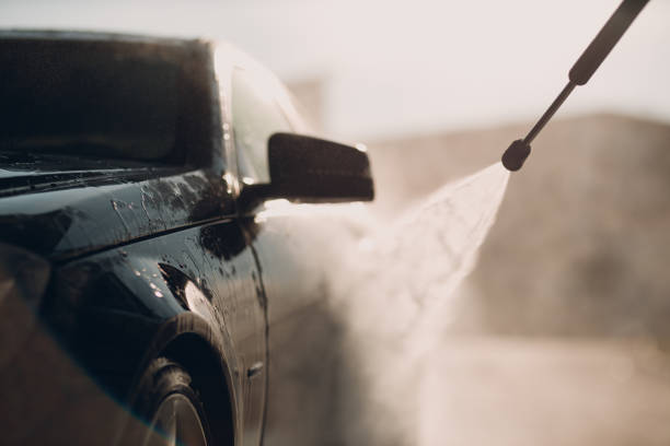 istock Worker washing car at self-service car wash 1510607688