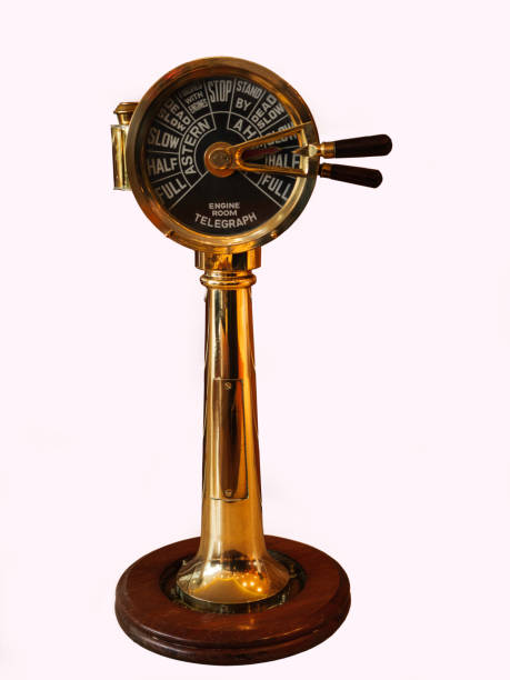 A brass ship telegraph indicating instructions to the engine room full length, isolated on white