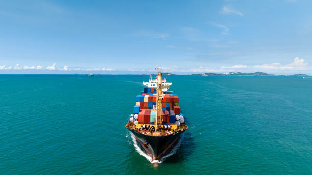 istock cargo logistics container ship sailing in green sea to import export goods and distributing products to dealer and consumers across worldwide, by container ship Transport business service 1510638240