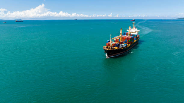 istock cargo logistics container ship sailing in green sea to import export goods and distributing products to dealer and consumers across worldwide, by container ship Transport business service 1510638241