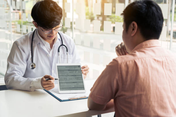 istock Asian doctor talking the patient at clinic while using the tablet explaining the patient condition and the treatment result. 1510680102
