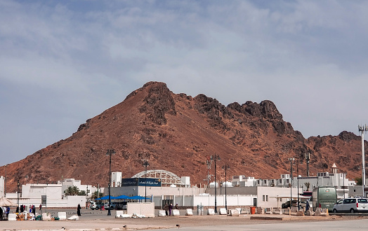 This mountain in the picture called jabal al ohud in arabic language, It was done during visit to saudi arabia for religious obligations in 2019, it is the holy 7 historical place for muslims to visit. this mountain is significantly important for the muslims around the world, the place where this mountain situation has linked with the war, it was once a battle field and the 2nd war or battle of islam  fought near this mountain and other reason its the burial place for more than 70 friends or companions sahaba of muhammad saw. 
Madina-Saudi Arabia-MAY,09-2019