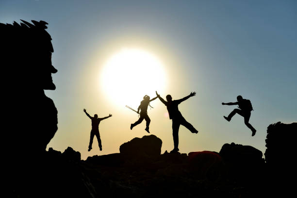 istock Sunrise Synchrony: The Team's Joyous Climb to Success 1510698569