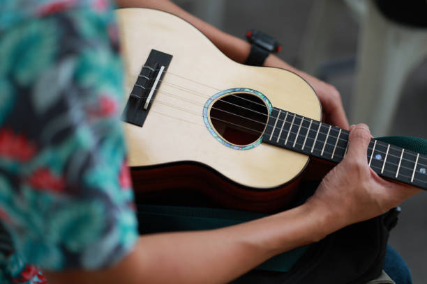 Close up of Ukulele on black background