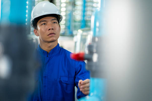 istock Asian technician engineer maintenance  Drinking water pipe and pressure tank . 1510742282
