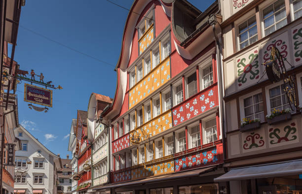 Typical Appenzell houses with colorful painted facades in the main street, Appenzell, Appenzell Innerhoden, Switzerland Appenzell, Canton Appenzell Innerrhoden, Switzerland - April 21, 2023. The town of Appenzell is the capital of the canton of Appenzell Innerrhoden in Switzerland. With its colorful painted wooden houses, Appenzell is one of the main attractions in Appenzellerland. appenzell innerrhoden stock pictures, royalty-free photos & images
