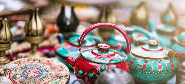 Traditional colorful ceramic teapots and tableware sale on nepalese street market