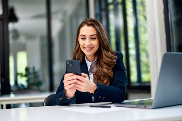 istock A pretty businesswoman using a mobile phone while working at the office. 1510779162