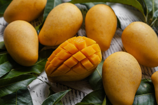 istock Ripe mangoes on white wood 1510785008