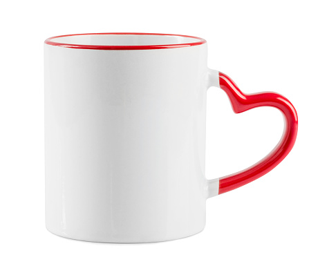 White mug with red heart shaped handle on a white background. White cup isolated on a white bachground.