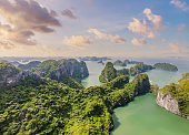 Aerial view panorama of floating fishing village and rock island, Halong Bay, Vietnam, Southeast Asia. UNESCO World Heritage Site. Junk boat cruise to Ha Long Bay. Popular landmark of Vietnam