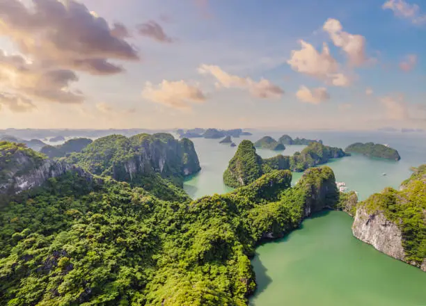 Aerial view panorama of floating fishing village and rock island, Halong Bay, Vietnam, Southeast Asia. UNESCO World Heritage Site. Junk boat cruise to Ha Long Bay. Popular landmark of Vietnam.