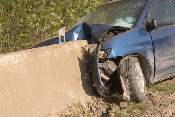 Crash. The car crashed into a concrete fence. The airbags went off. Road safety and auto responsibility stock photo