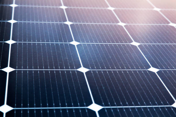 istock Solar panel close-up with the rays of the setting sun in the corner. 1510847435