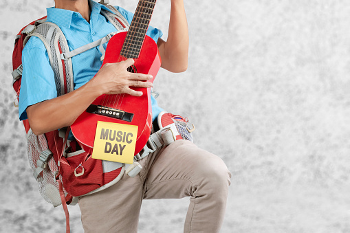 Man playing the guitar. World music day concept