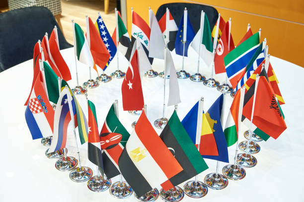 istock Flags of countries of world on negotiating table 1510861663