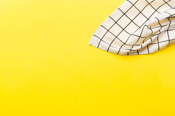 istock top view with white empty kitchen napkin isolated on table background. Folded cloth for mockup with copy space, Flat lay. Minimal style 1510864373