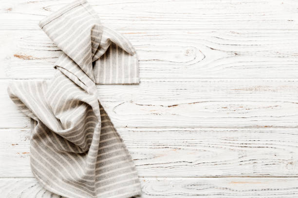 istock top view with gray kitchen napkin isolated on table background. Folded cloth for mockup with copy space, Flat lay. Minimal style 1510864378