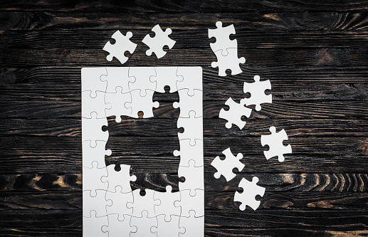 Jigsaw puzzle, with one missing piece, of a graph showing investment returns.