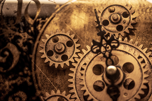 Gears rotating abstract inside an antique watch. Concepts for success, methods, systems of reaching goals. Concept of teamwork and togetherness.