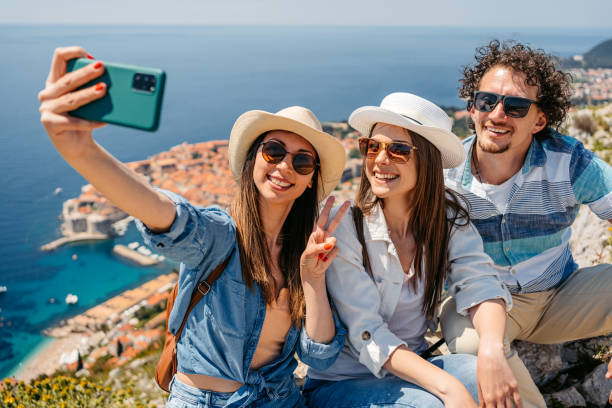 istock Three Friends Taking Selfies At A High Viewpoint Of Dubrovnik 1510902629