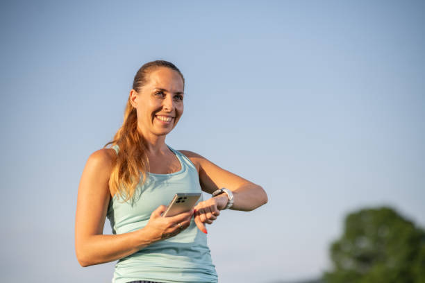 istock A woman after a run, reached the goal with app tracking 1510902652
