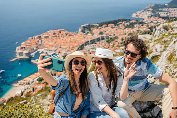 istock Three Friends Taking Selfies At A High Viewpoint Of Dubrovnik 1510904253