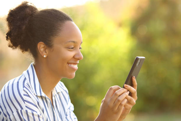 istock Happy black woman using cell phone in a park 1510956650