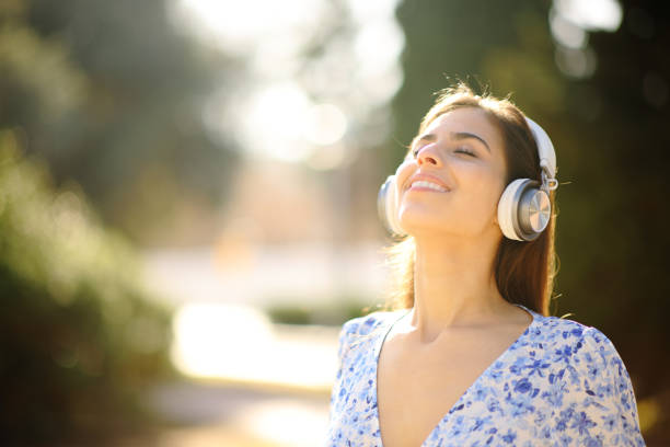 istock Woman relaxing mind breathing with headphone 1510962179
