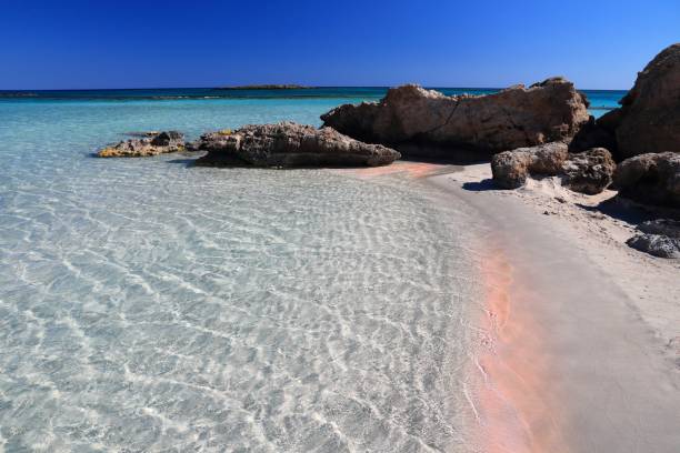 Crete pink sand beach in Greece stock photo