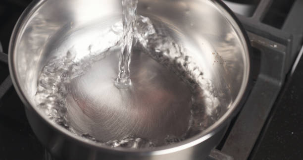 istock Handheld shot of pouring water into saucepan 1510977510