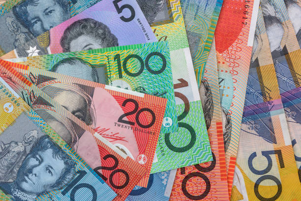 istock Australian dollar banknotes on wooden table close up 1510983993