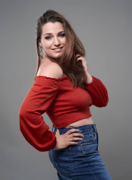 istock Confident plus size woman on gray background 1511026075