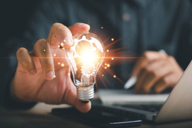 istock Businessman protects a glowing light bulb, symbolizing creativity and innovation 1511026683