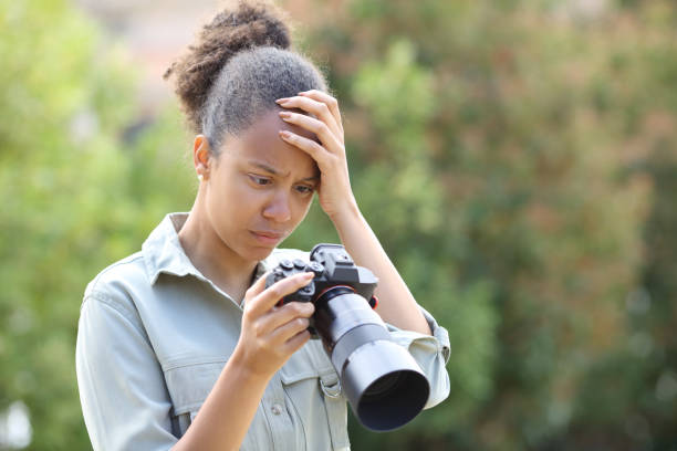 istock Black photographer complaining checking photos on camera 1511040600