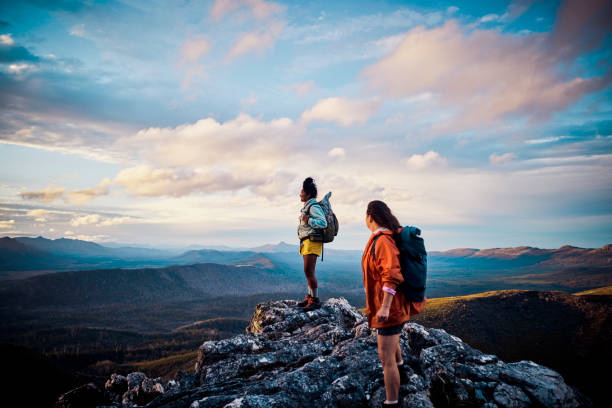 Women hikers embracing the untamed beauty of Tasmania through exhilarating bushwalking. stock photo