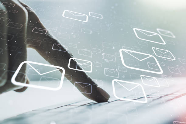 istock Creative concept of postal envelopes illustration with hands typing on laptop on background. Email and communications concept. Multiexposure 1511070716