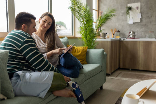 istock Young man and his friend using a tablet together at home 1511083223