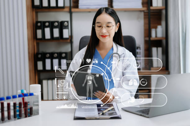 istock medical technology concept,smart Asian doctor hand working with modern laptop computer with his team virtual icon diagram. in hospital 1511086304