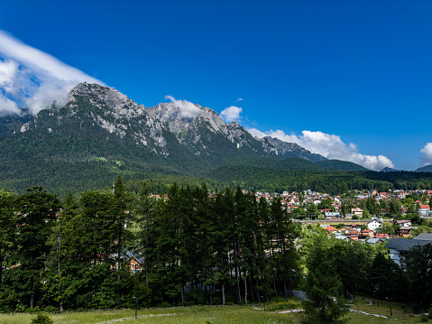 Nature's masterpiece unfolds before you, with jagged peaks standing tall against a backdrop of clear blue skies.