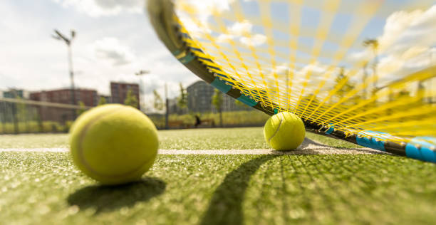 Tennis racket and balls, flat lay. Space for text stock photo