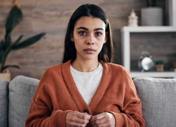 portrait, mental health and therapy with a black woman patient in an office, sitting in an office to talk about depression. - female emotional stress african ethnicity loss imagens e fotografias de stock