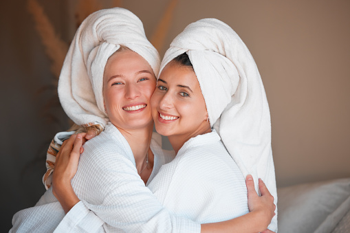 Portrait, spa and women hug, skincare and cosmetics with salon treatment, relax and getaway for reunion. Face, females and friends on holiday, vacation and grooming on resort trip, smile and embrace