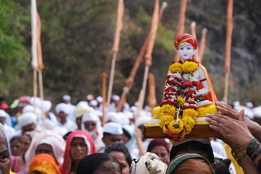 Pune, India 14 July 2023, cheerful Pilgrims at Palkhi, During Pandharpur wari procession Pilgrims marching toward Vitthala temple with singing religious song at Dive Ghat, Pune, Maharashtra, India.