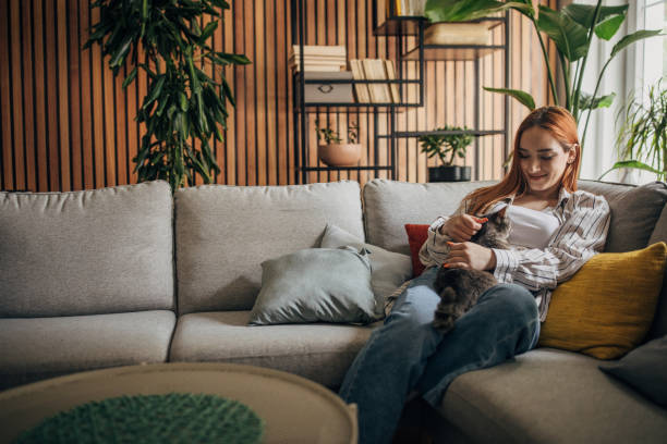 istock Young woman cuddling with cat at home 1511211732