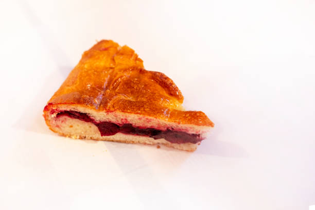 piece of cherry sweet pie on a light background