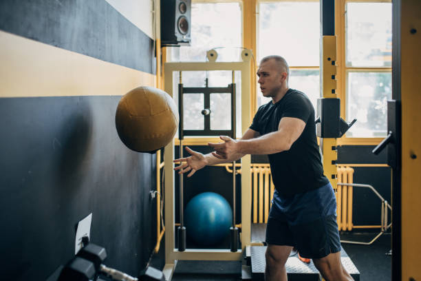 istock Man training with medicine ball 1511230759